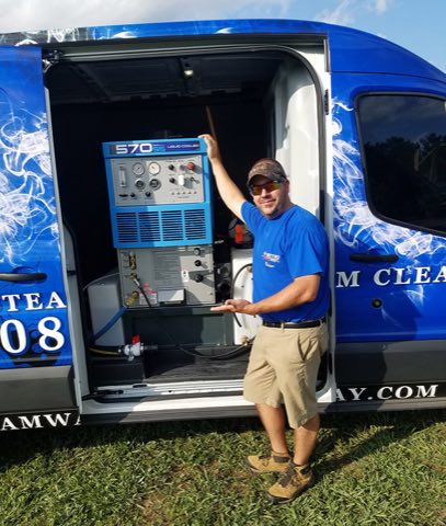 Owner Brian Sniatecki with the truck-mounted cleaning system